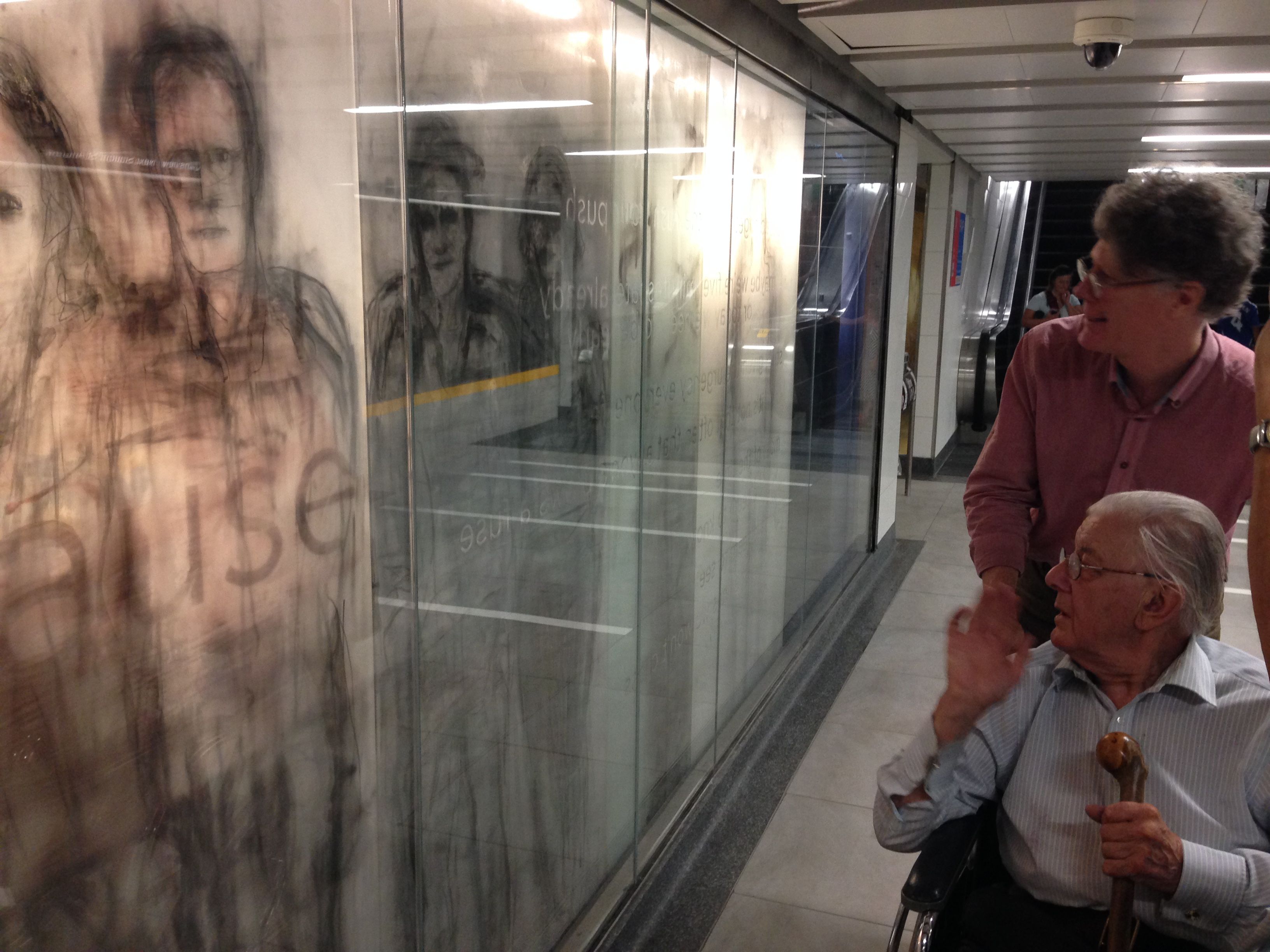 Stuart Reid and Patrick Reyntiens at Union Subway Station,Toronto, viewing his 104 foot long artwork